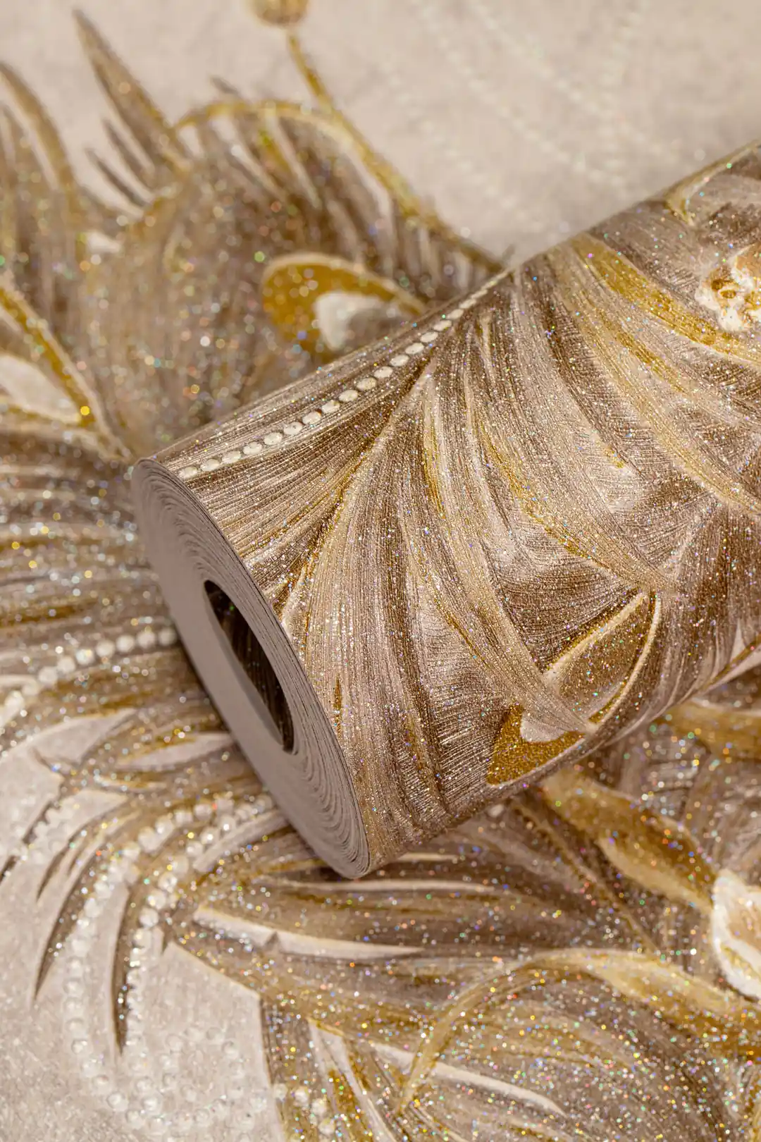 Full roll of beige peacock feather wallpaper with embossed gold and glitter detailing on floral motifs