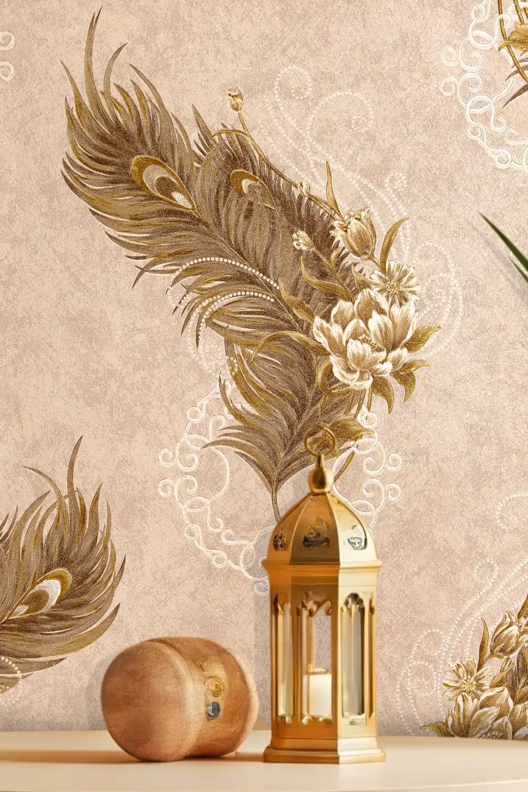 Close-up of golden peacock feather and lotus flower motif on beige wallpaper beside a brass lantern
