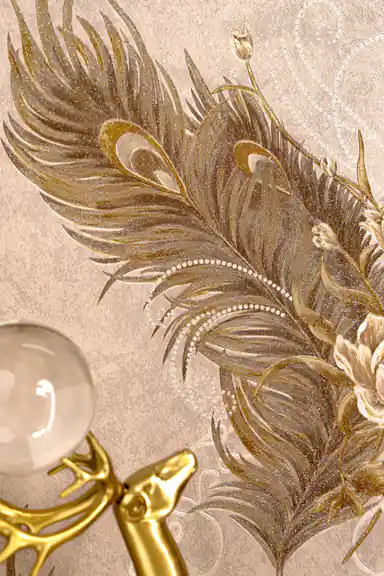 Detailed view of embossed peacock feather pattern with gold accents and a crystal orb on beige wallpaper