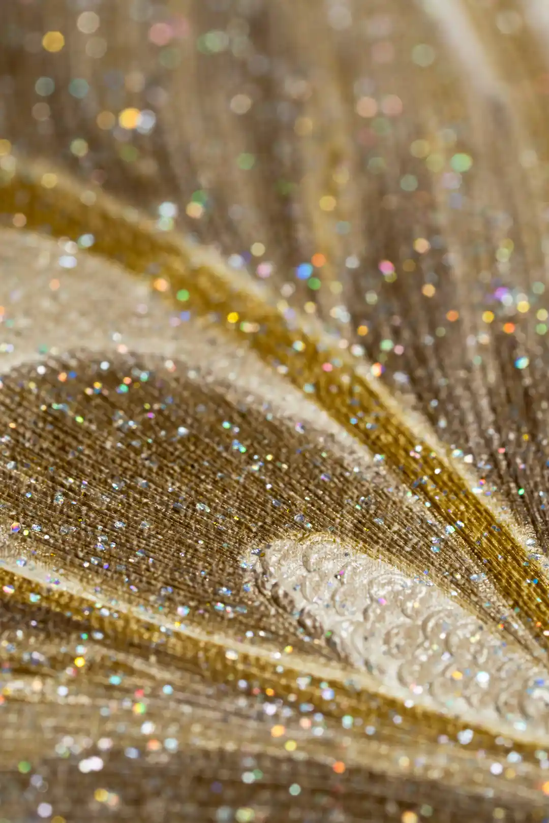 Extreme close-up showing iridescent glitter texture on the peacock feather wallpaper surface