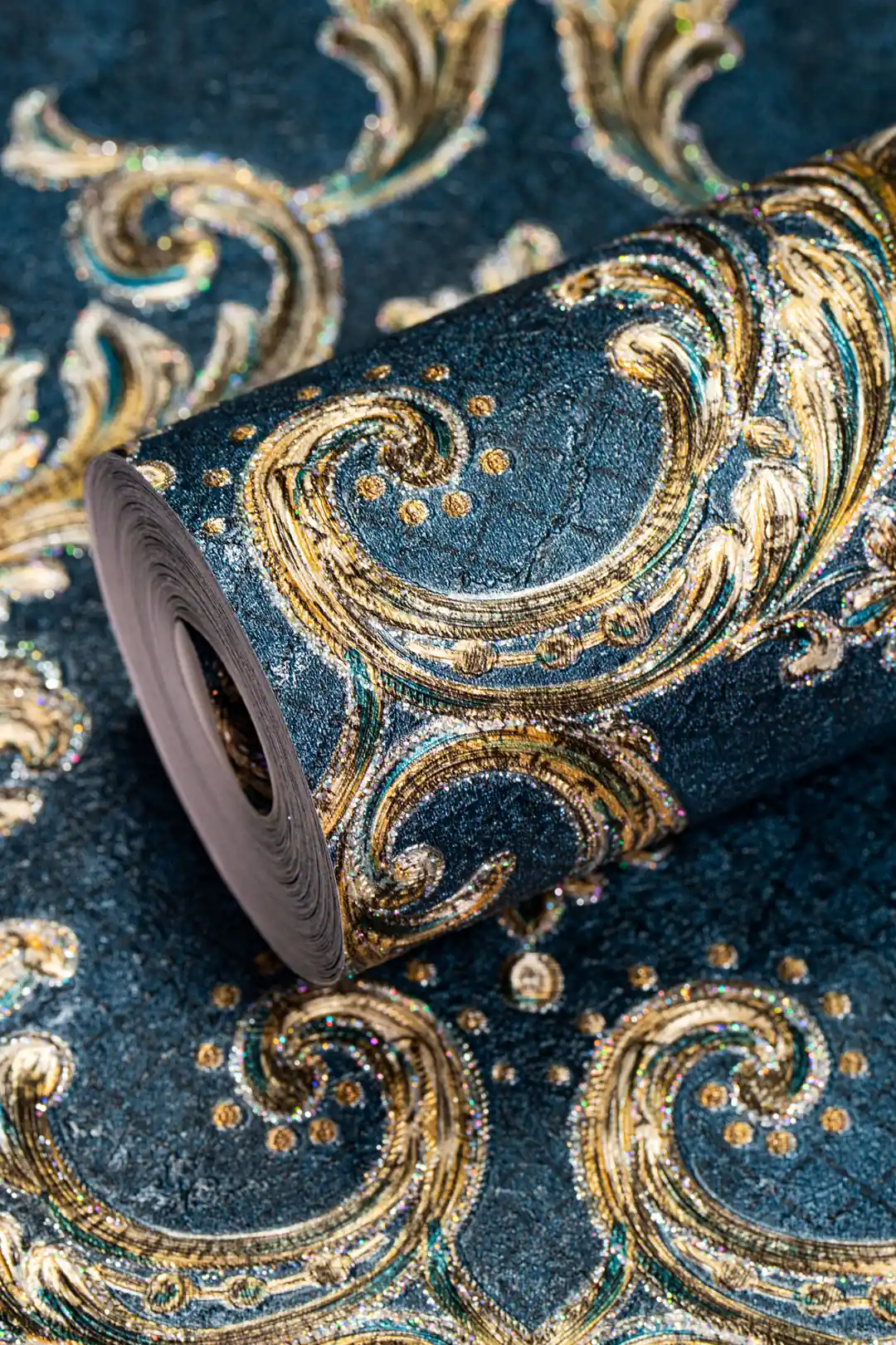 Full roll of deep teal damask wallpaper with ornate embossed gold scrollwork and glitter accents