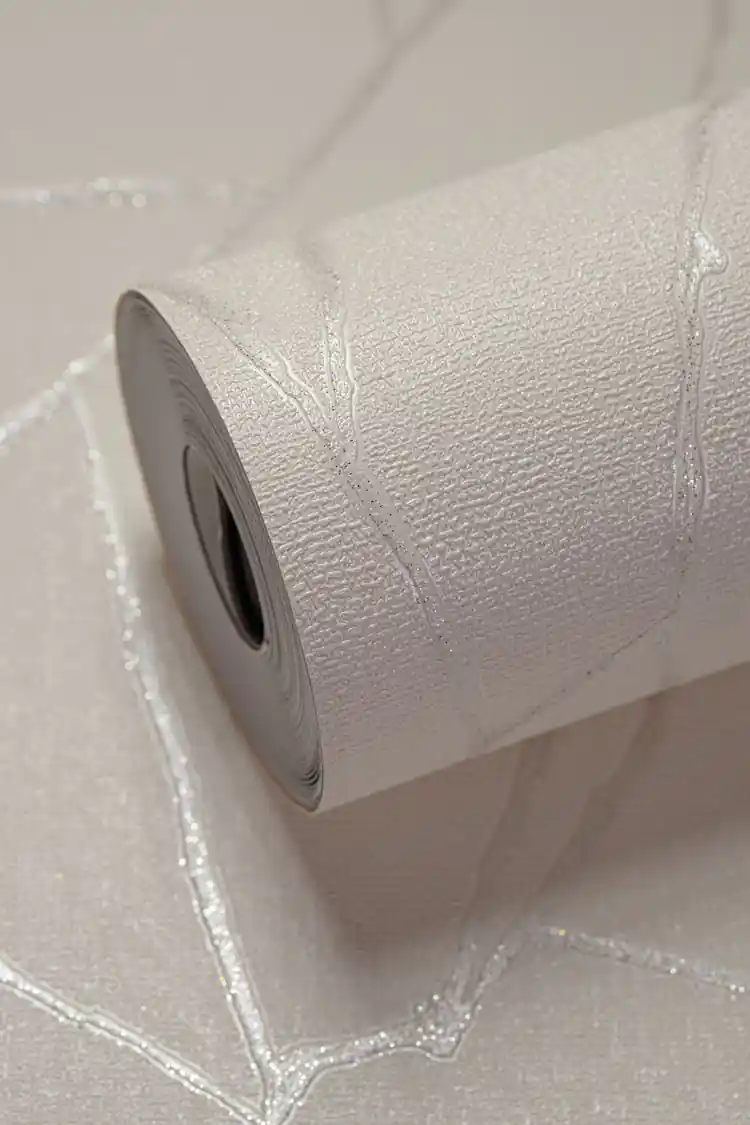Full roll of white textured wallpaper showing silver abstract veins on a soft off-white surface