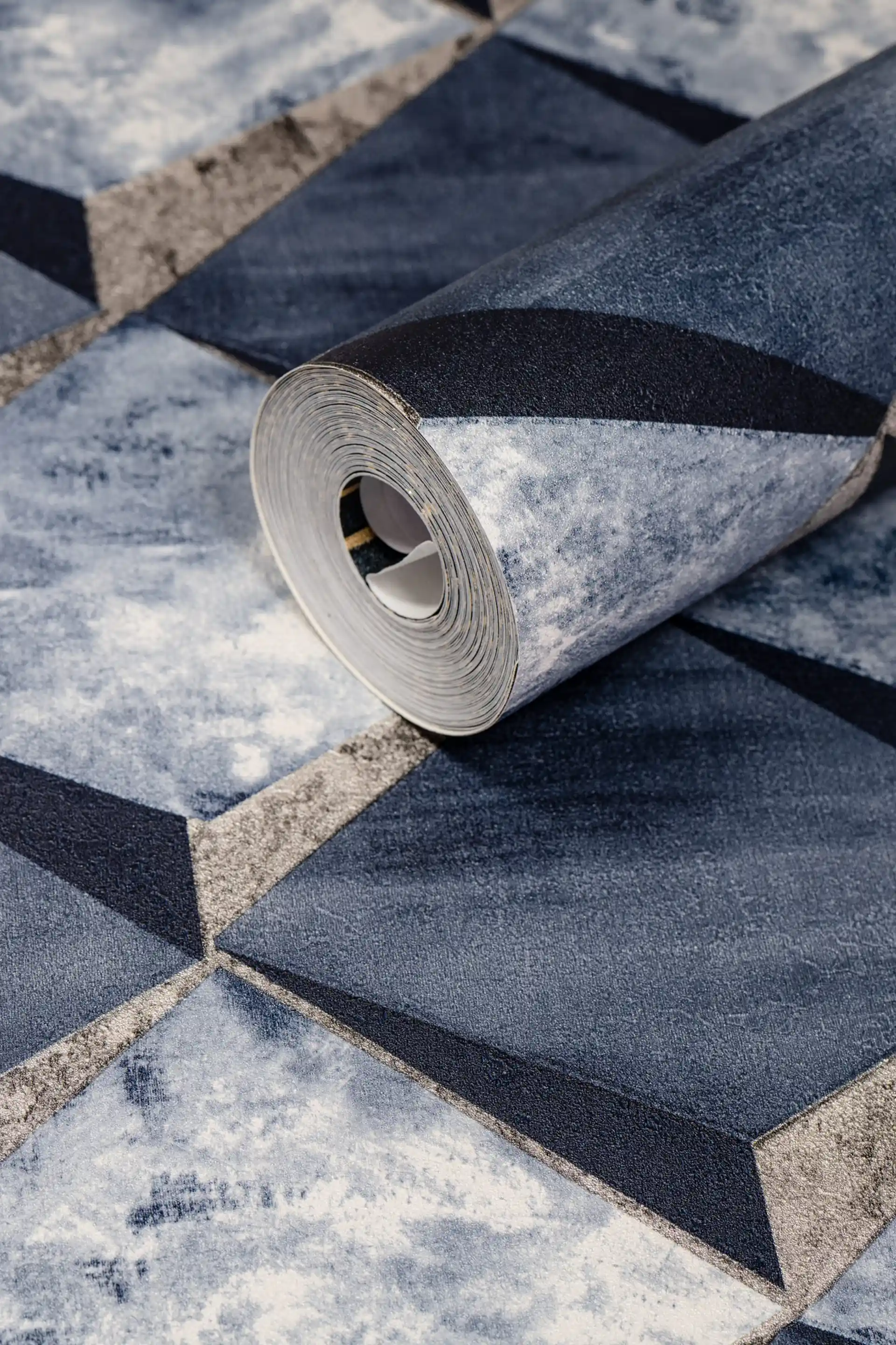 Full roll of 3D blue cubes wallpaper with blue-grey geometric design and textured matte finish