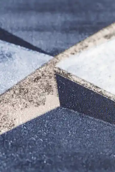 Extreme close-up of 3D blue cube wallpaper showing geometric depth and matte texture detail