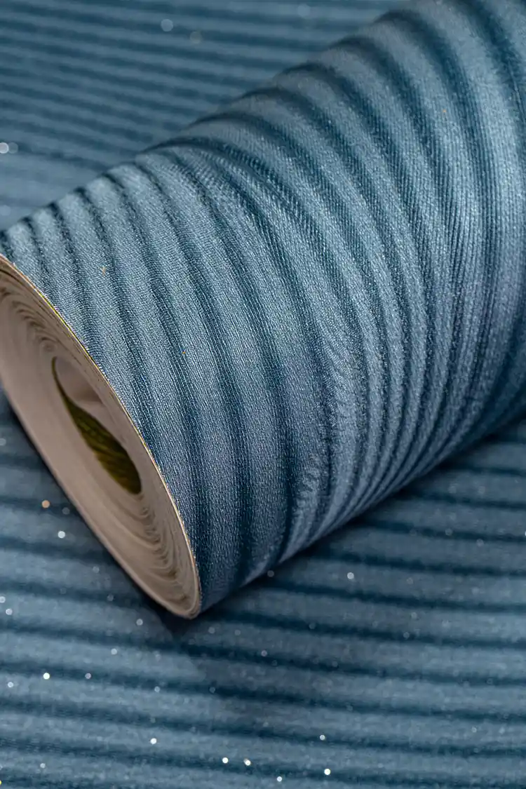 Full roll of teal wave illusion wallpaper with 3D optical ripple design and shimmer sparkle