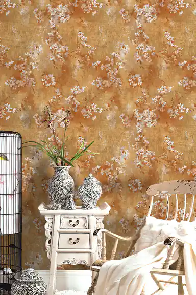 Gold blossom wallpaper installed in a vintage bedroom with white furniture and decorative vases