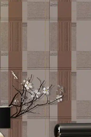 Close-up of brown and grey geometric block pattern wallpaper with gold accent lines and cherry blossom vase highlighting the pattern