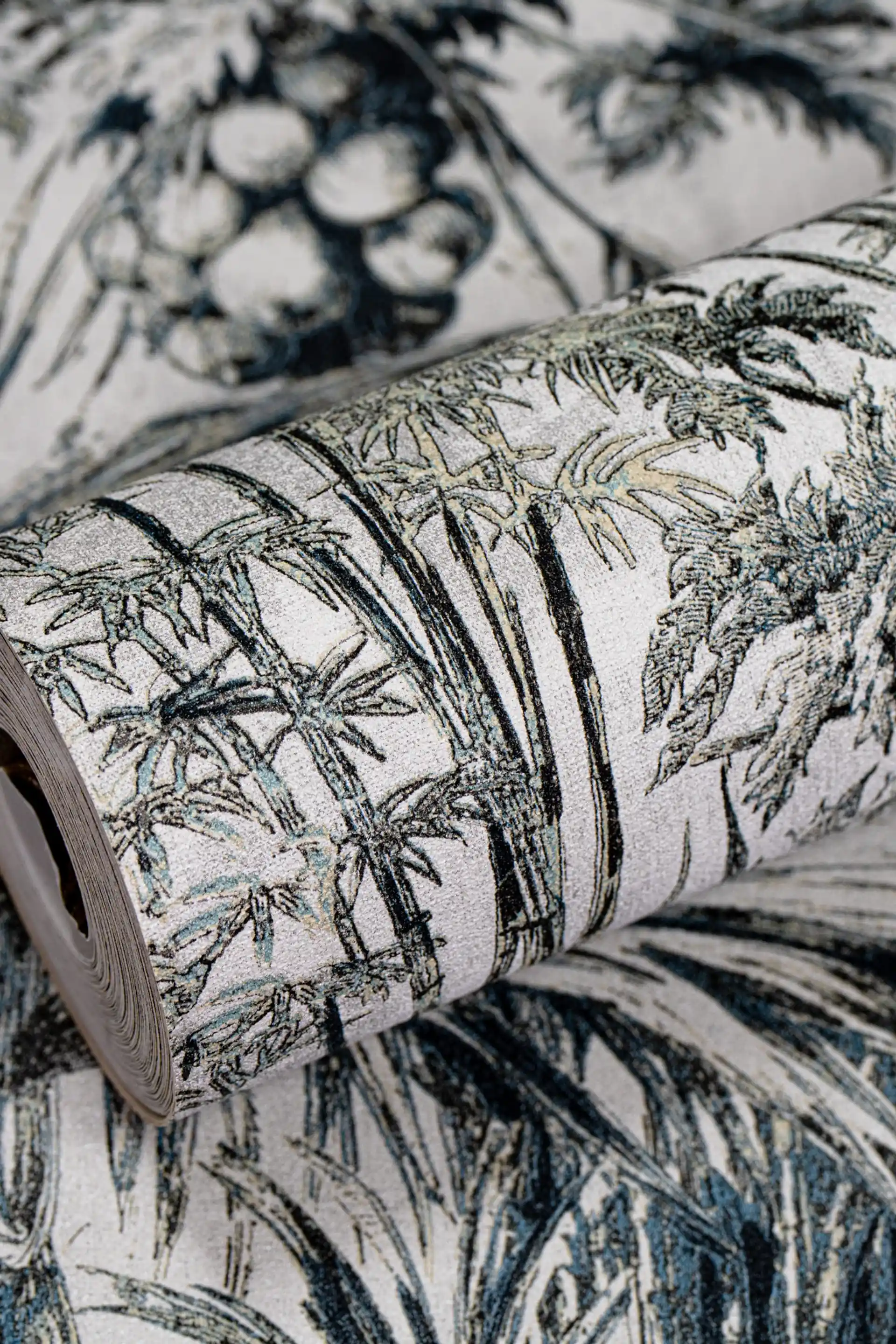 Full roll of tropical forest sketch wallpaper with dark green botanical palm and tree illustrations on white base