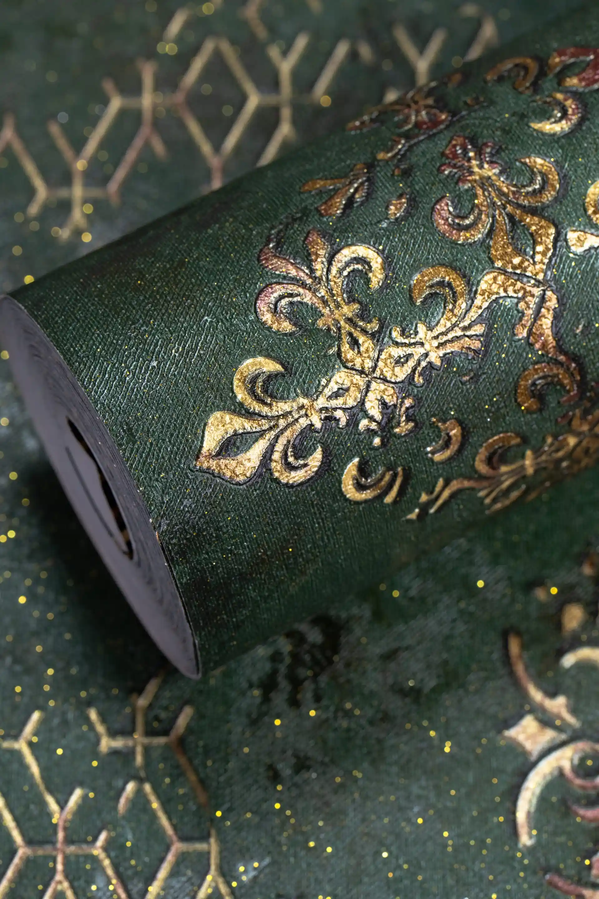 Full roll of emerald green wallpaper with gold geometric-damask motif and sparkle finish