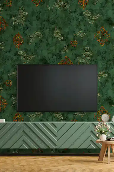 Emerald green wallpaper installed behind a TV unit with green console and gold damask accents