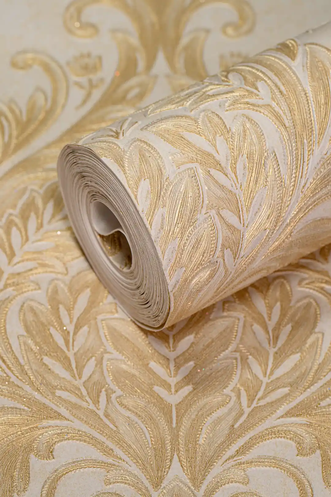 Full roll of golden leaf damask wallpaper with embossed cream and gold acanthus scrollwork