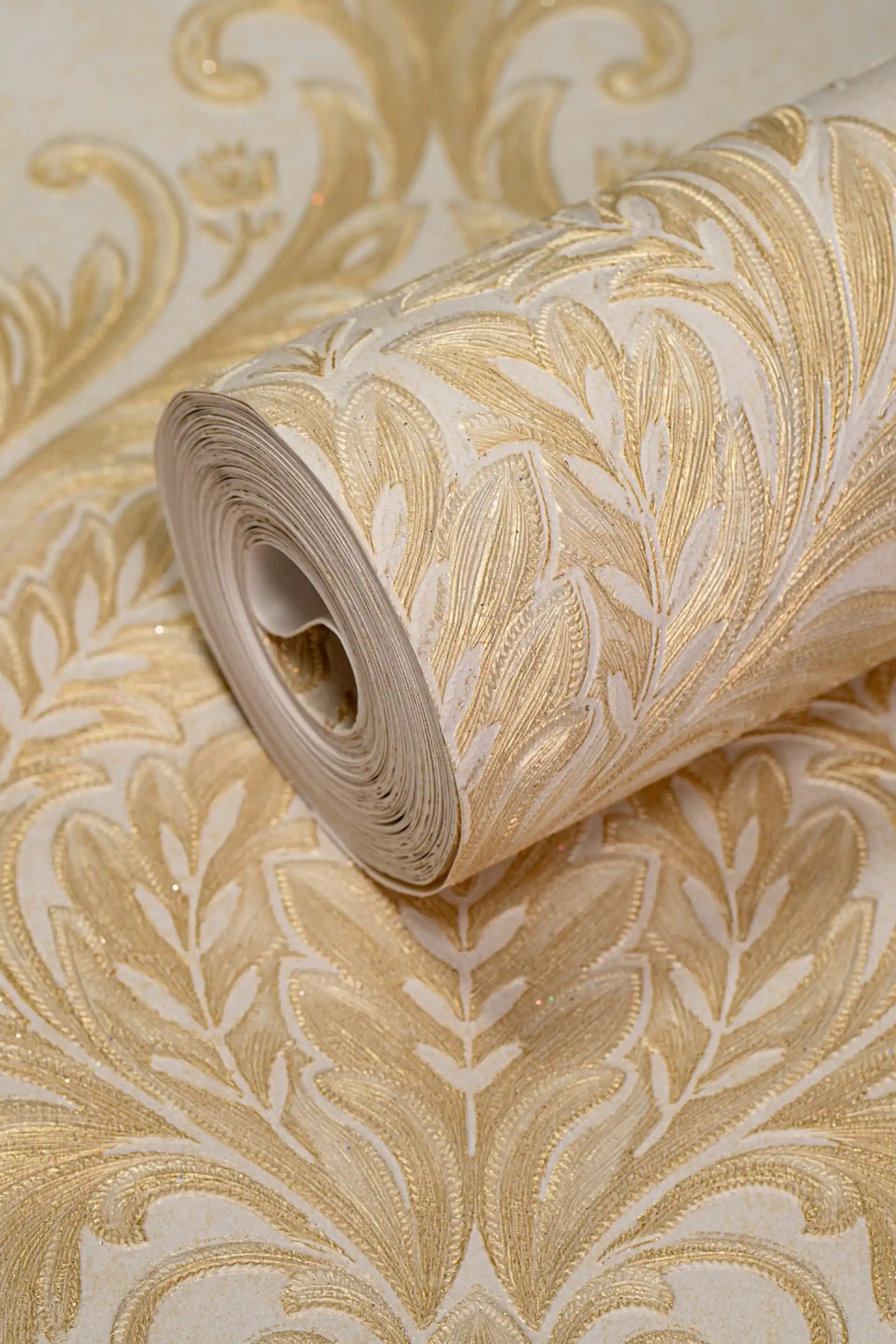 Full roll of golden leaf damask wallpaper with embossed cream and gold acanthus scrollwork