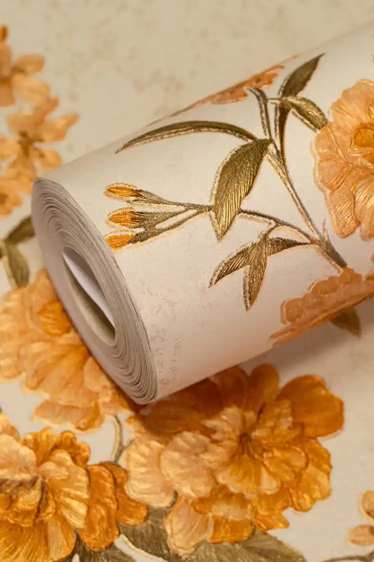 Wallpaper roll showing golden orange peony blooms and olive branches on cream shimmer background