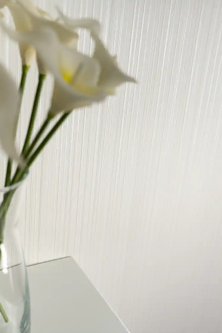 Close-up of white silk stripe wallpaper pattern showing alternating matte and shimmer lines