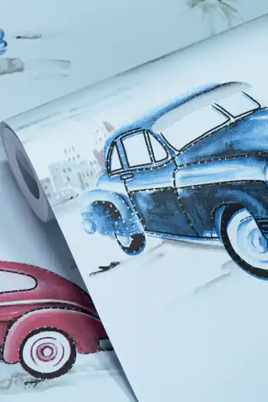 Wallpaper roll with colorful vintage cars and palm trees on a light blue base with glitter finish