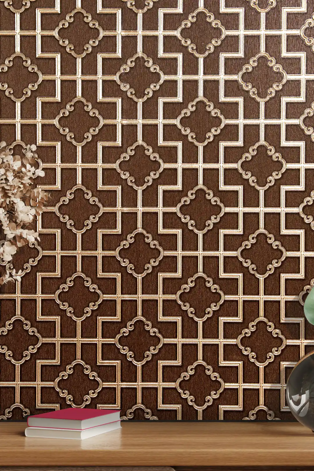 Close-up of brown trellis wallpaper with gold metallic quatrefoil medallions and green plant leaves