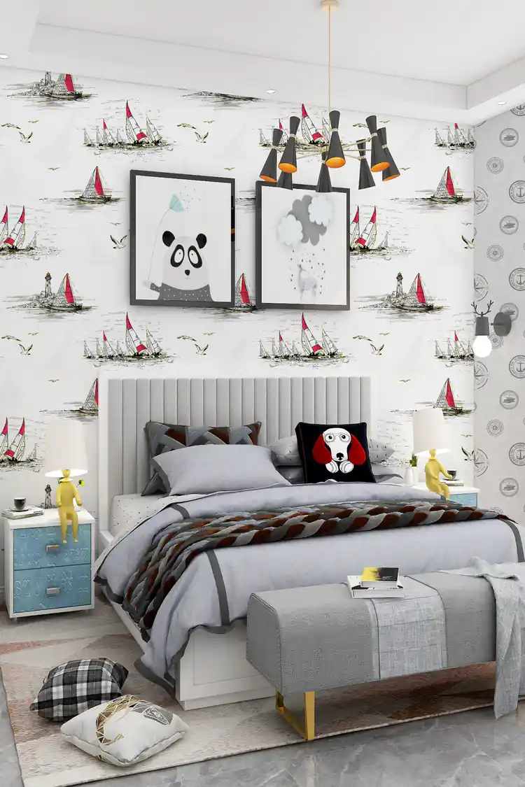Kids bedroom with white nautical sailboat wallpaper, framed art, modern pendant lights, and grey bed