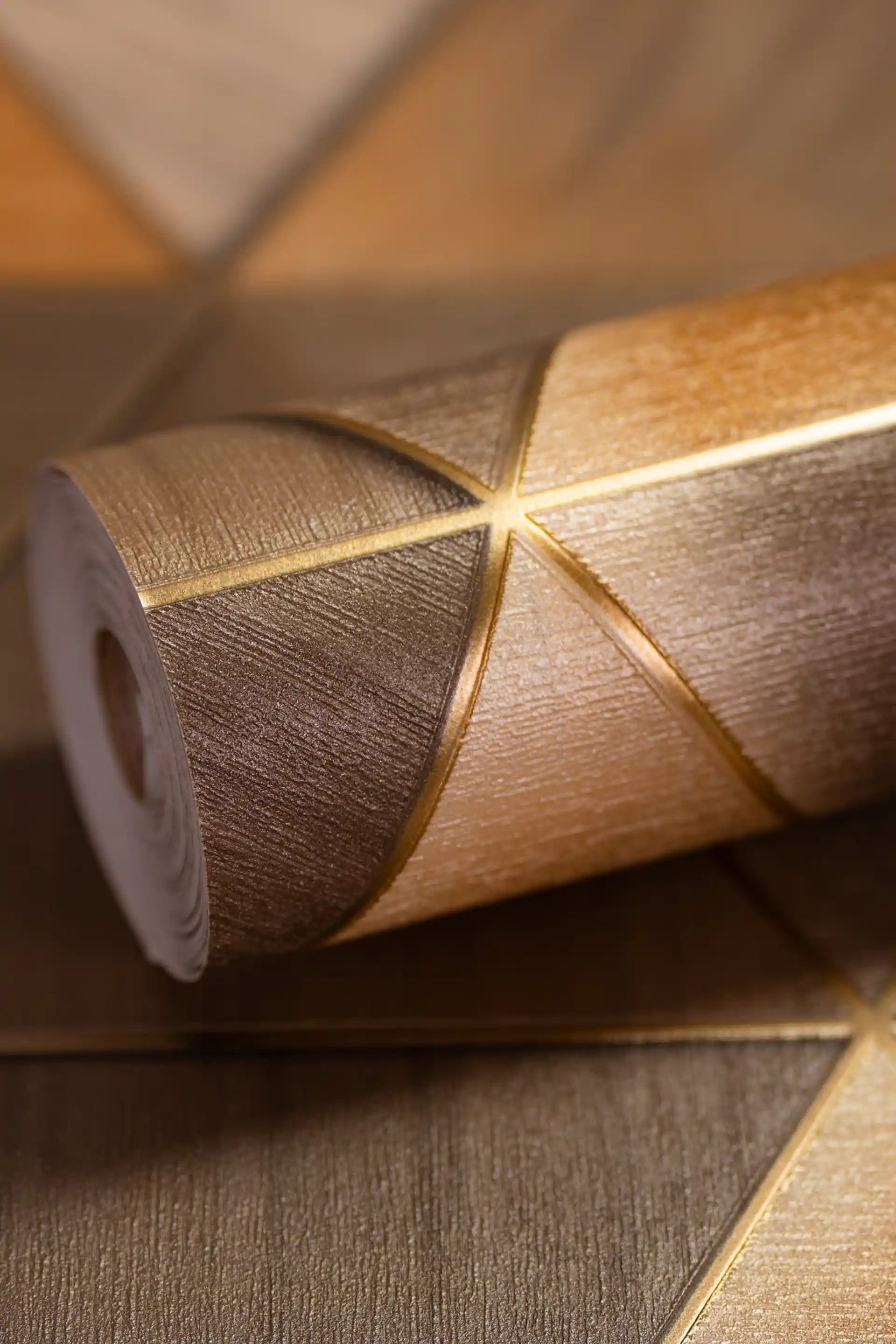 3D geometric triangle wallpaper roll in bronze and gold tones with metallic gold line accents