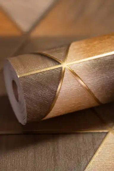 3D geometric triangle wallpaper roll in bronze and gold tones with metallic gold line accents