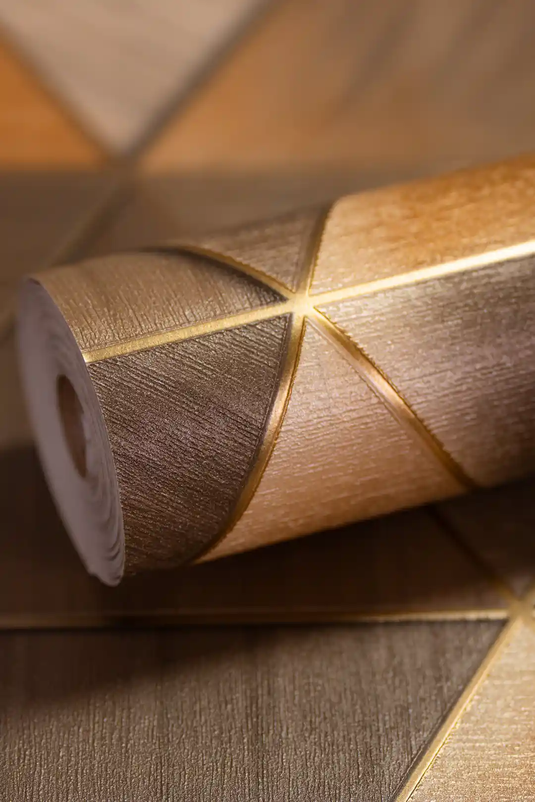 3D geometric triangle wallpaper roll in bronze and gold tones with metallic gold line accents