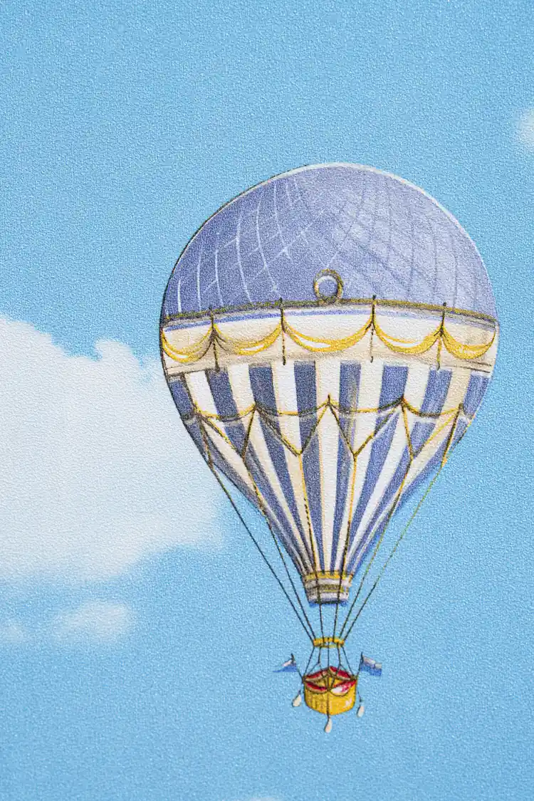 Detailed view of single blue striped hot air balloon floating among white clouds on wallpaper