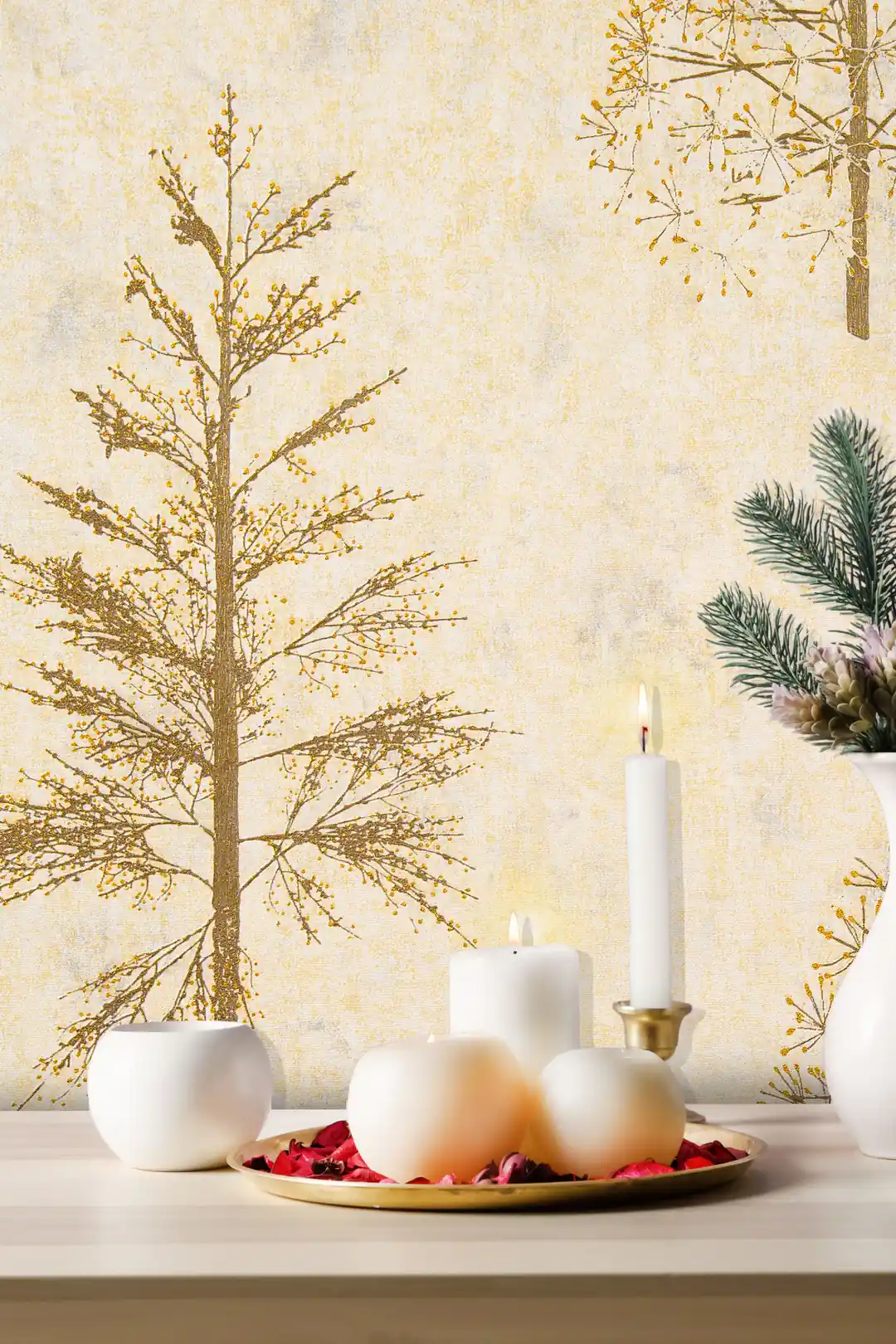 Close-up of gold glitter pine tree on cream wallpaper with white candles and festive decor