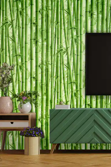 Lush green bamboo forest wallpaper installed behind a modern TV unit with decorative flowers and green cabinet