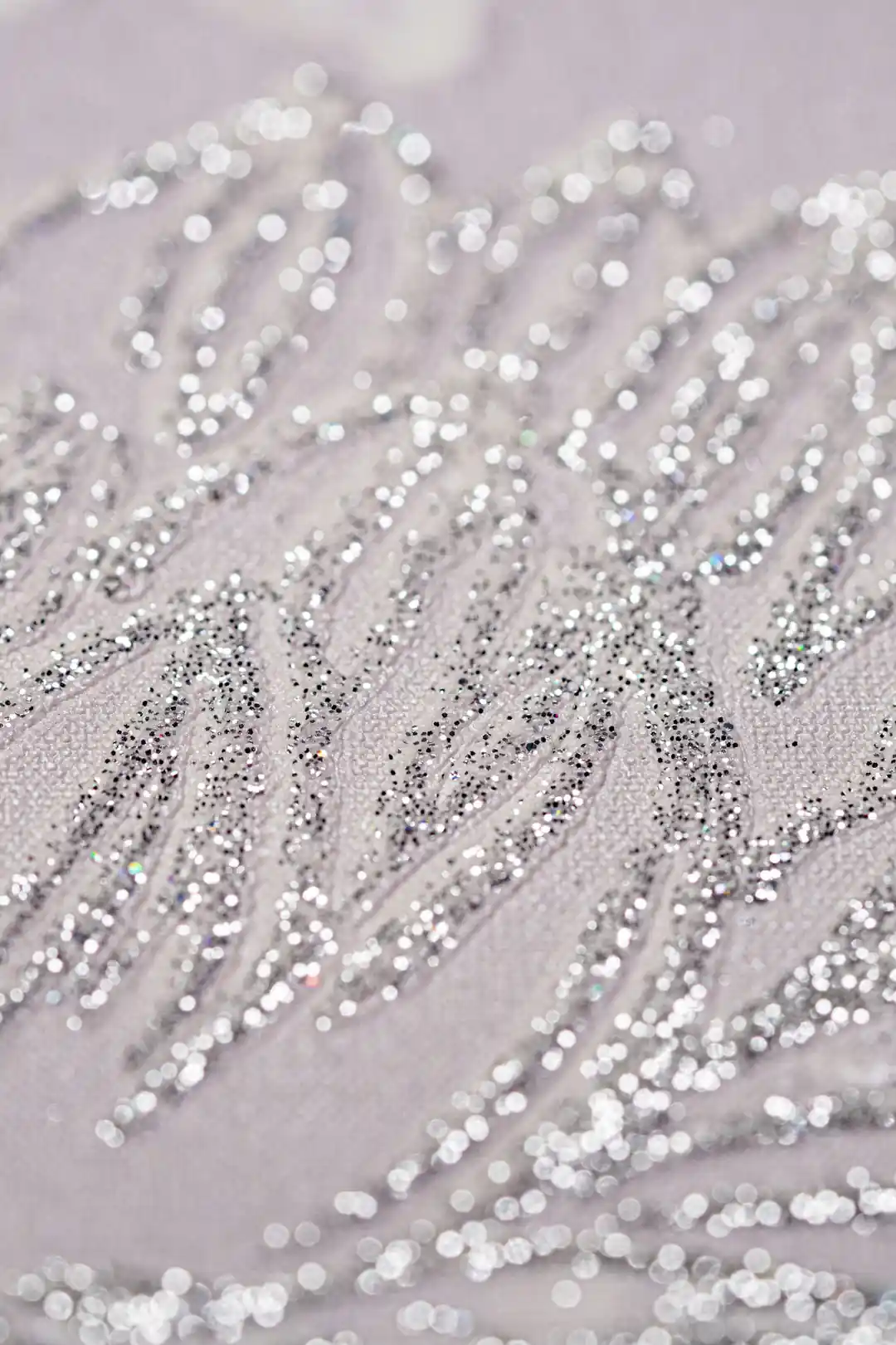 Extreme macro detail of sparkling silver glitter petals on pink chrysanthemum wallpaper texture