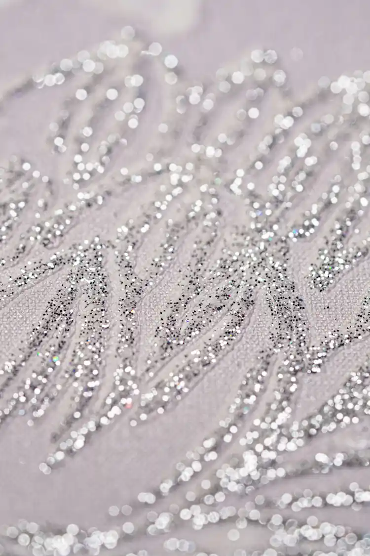 Extreme macro detail of sparkling silver glitter petals on pink chrysanthemum wallpaper texture