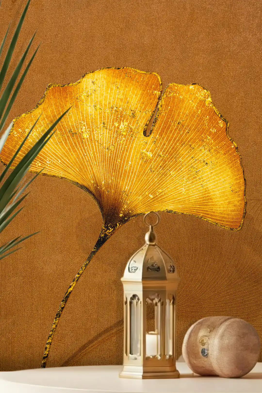 Warm gold ginkgo leaf wallpaper with a large glittering fan-shaped leaf on a rich brown textured background