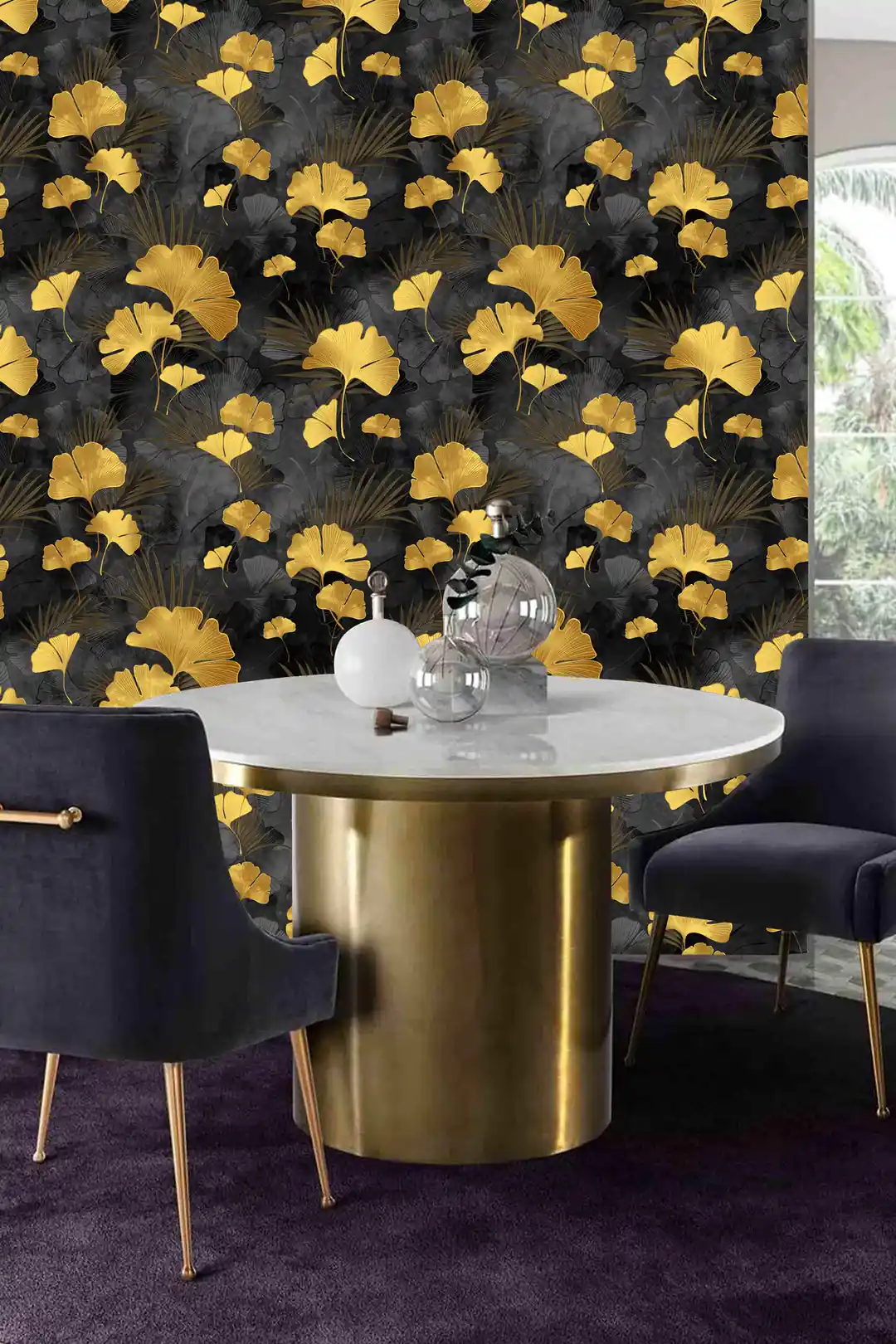 Dining room with black and gold ginkgo wallpaper behind a marble table with velvet navy chairs and gold base