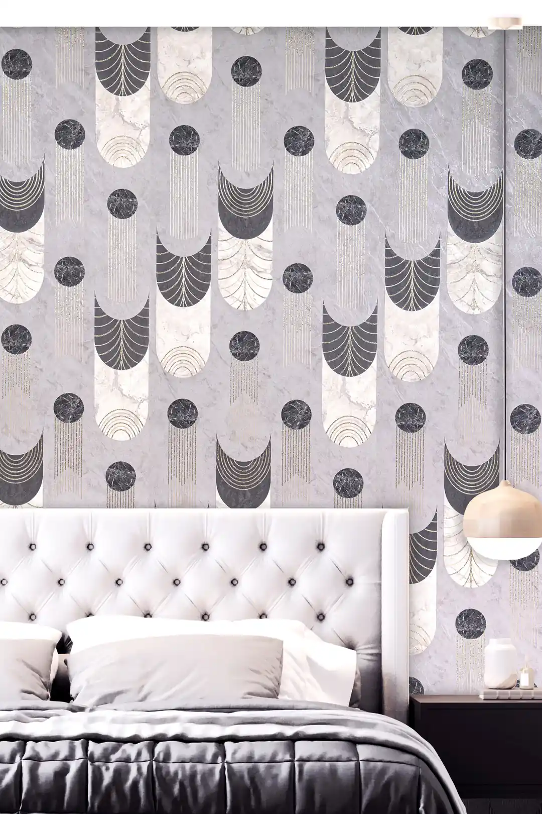 Bedroom with grey art deco wallpaper behind a tufted white headboard with pendant lamp and grey bedding