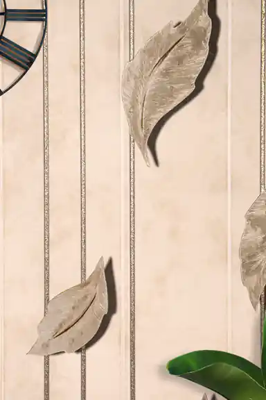 Installed leaf wallpaper close-up showing 3D gold-beige leaves with glitter vertical stripes and a wall clock