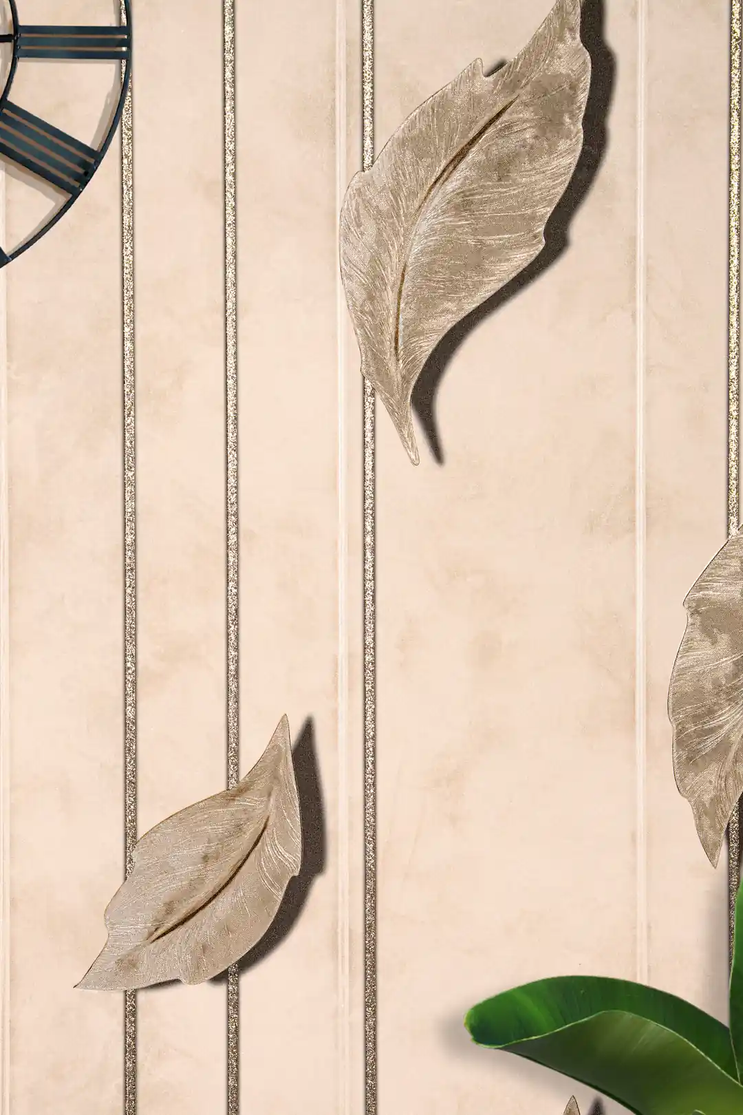 Installed leaf wallpaper close-up showing 3D gold-beige leaves with glitter vertical stripes and a wall clock