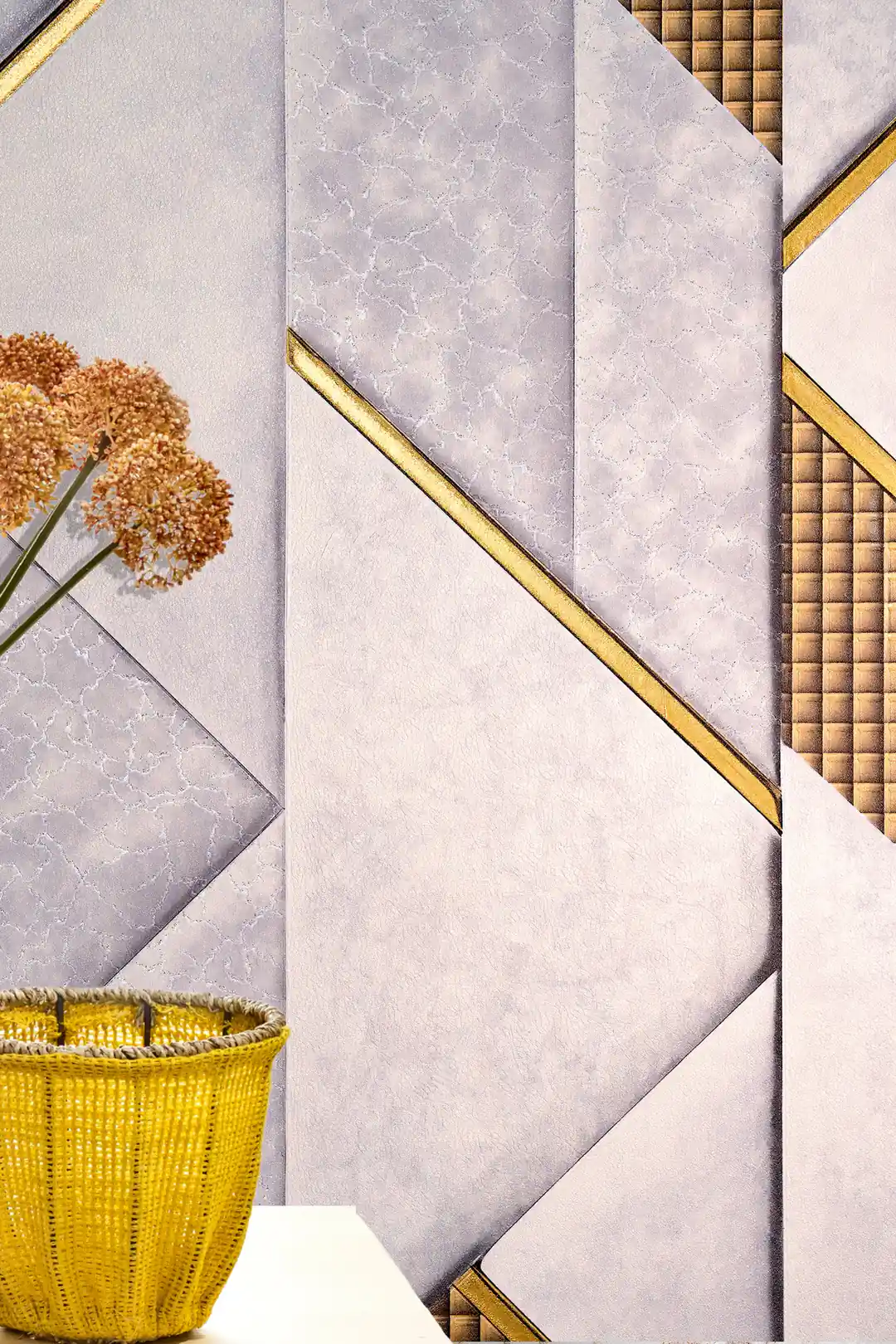Close-up of grey and lavender geometric wallpaper with gold quilted grid panels behind a woven basket with dried flowers