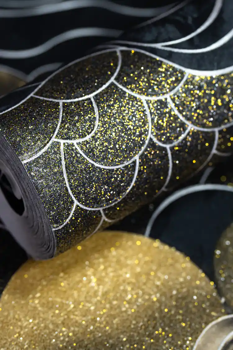 Black wallpaper roll with abstract cloud scales, golden suns, and silver wave patterns with glitter accents