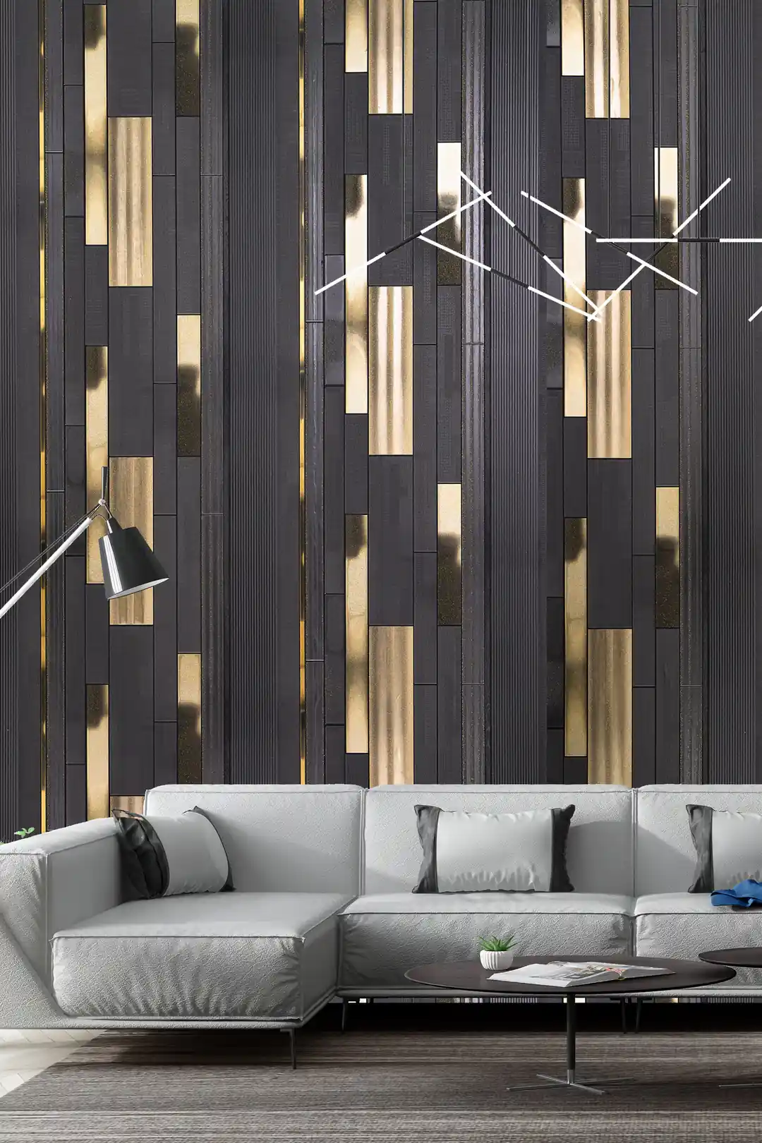 Dark charcoal and gold vertical strip wallpaper installed in a modern living room with grey sectional sofa and geometric light fixture