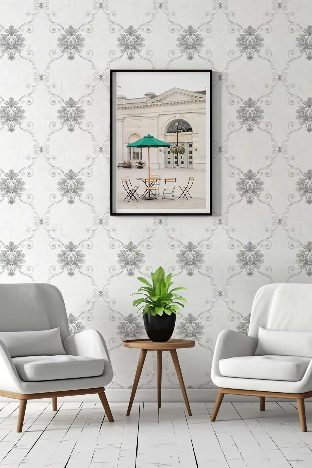 Silver damask wallpaper in an elegant sitting room with grey armchairs, potted plant, and framed wall art
