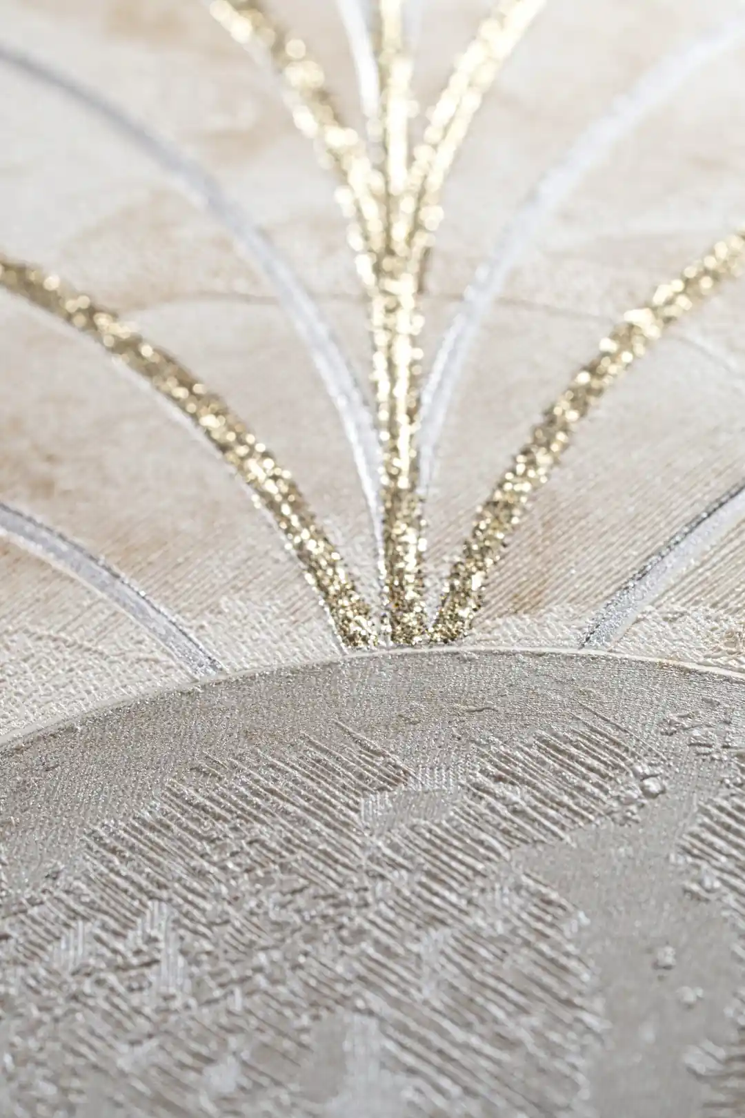 Extreme close-up macro of gold glitter lines radiating from a marble arch on beige textured background