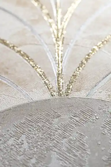 Extreme close-up macro of gold glitter lines radiating from a marble arch on beige textured background