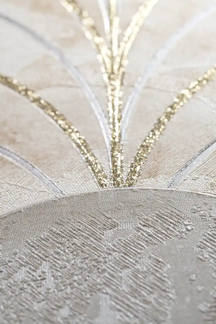 Extreme close-up macro of gold glitter lines radiating from a marble arch on beige textured background