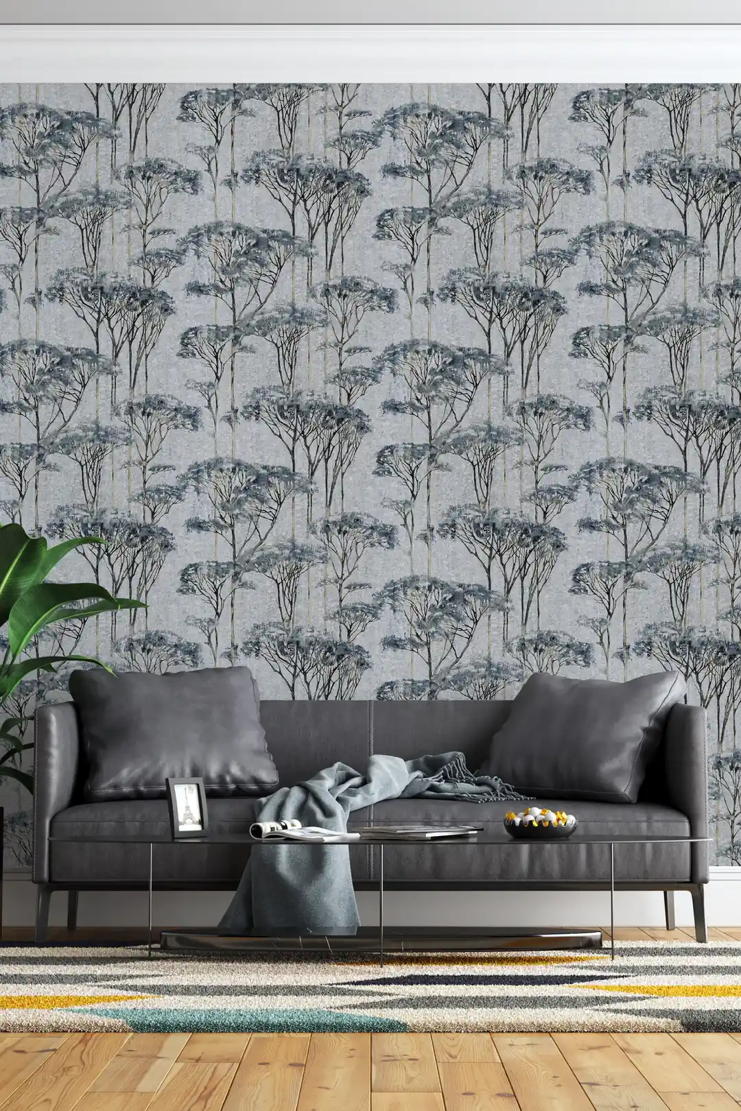 Blue and grey forest trees wallpaper installed in a living room with dark leather sofa and modern decor