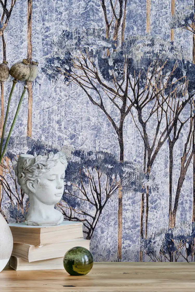 Close-up of misty blue forest wallpaper with detailed tree branches beside a classical bust and dried pods