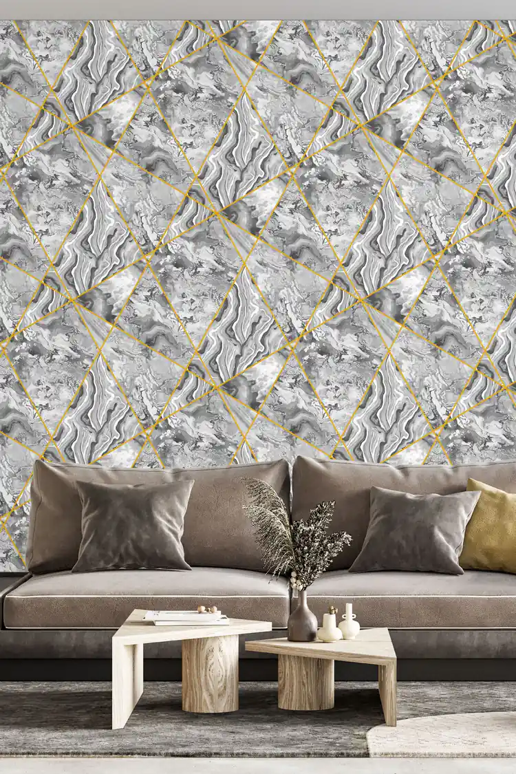 Grey marble panels wallpaper with gold lines installed in a living room with grey upholstered sofa