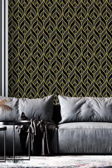 Black and gold leaf pattern wallpaper with elegant gold outlines on dark background in a modern living room with grey sofa