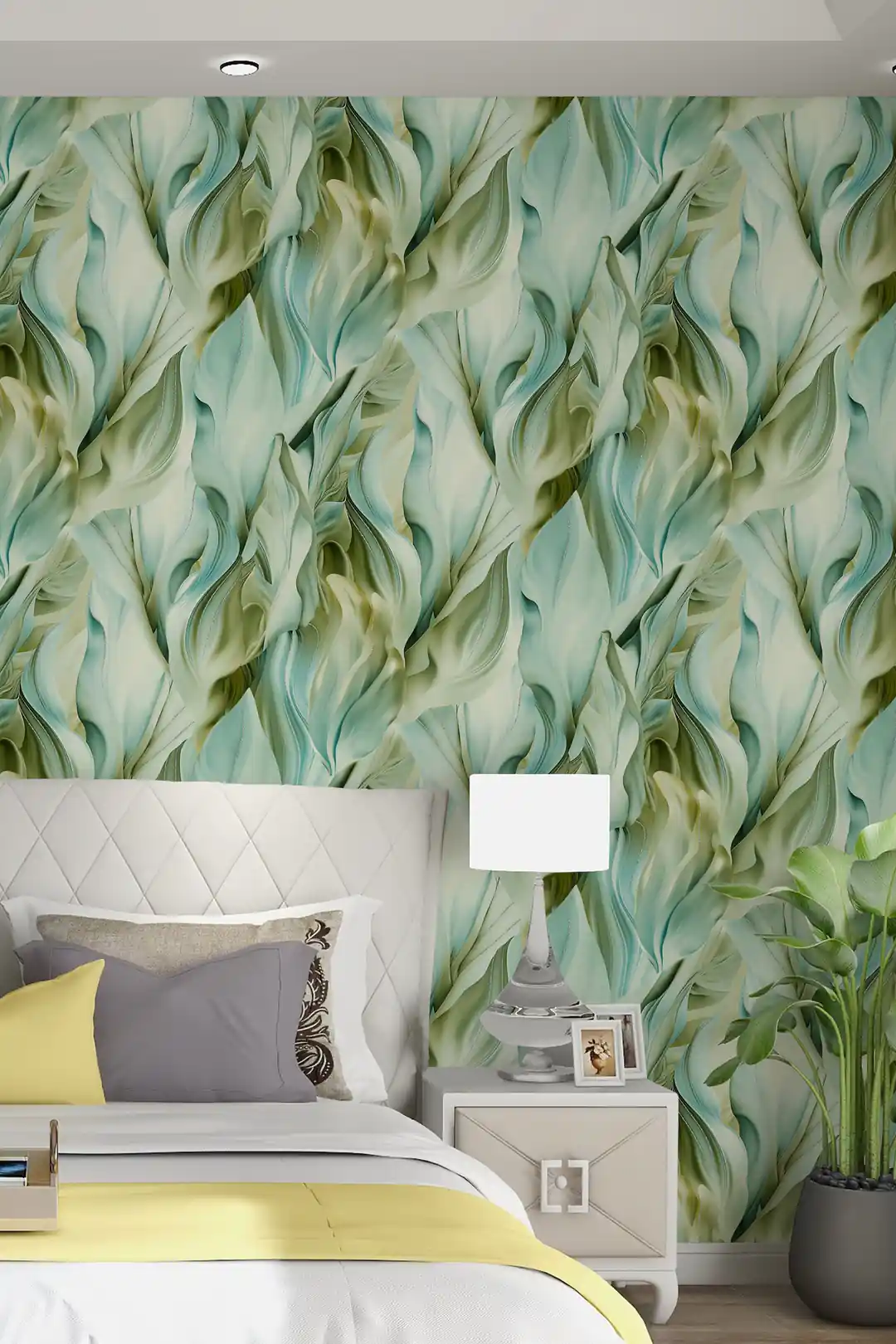 Sage green leaf wallpaper installed in a bright bedroom with white bed, yellow duvet, and nightstand