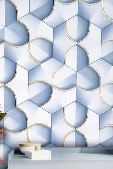 Installed wall view of 3D blue hexagon petal wallpaper above a white shelf with decor