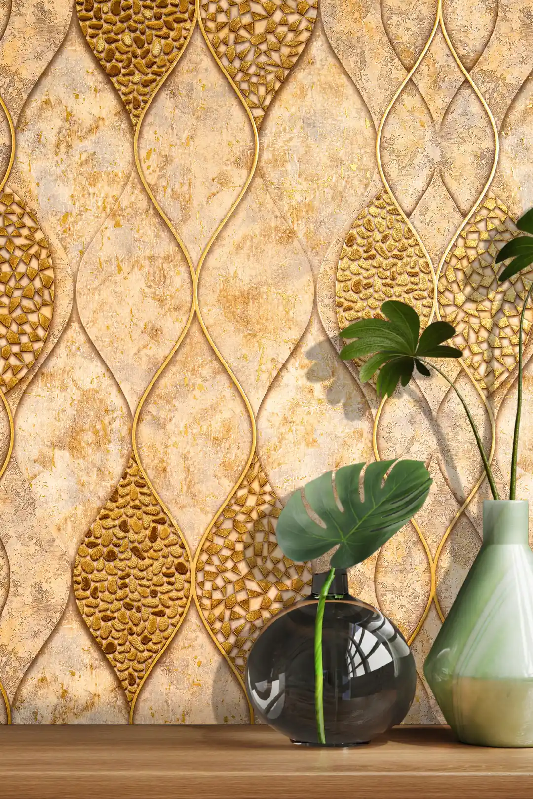 Styled close-up of gold mosaic leaf wallpaper with a green monstera leaf in a round vase