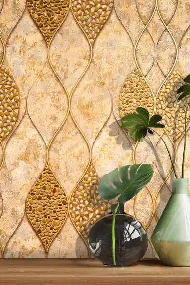 Styled close-up of gold mosaic leaf wallpaper with a green monstera leaf in a round vase