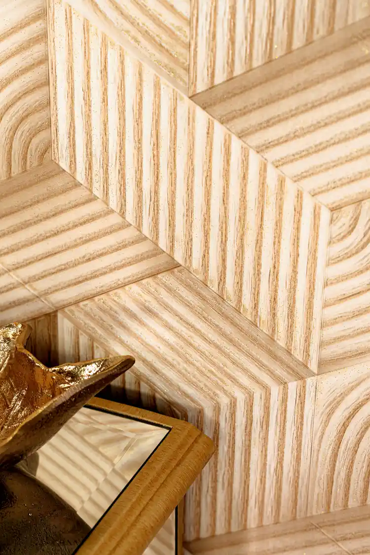 Angled close-up of the carved wood grain hexagon chevron pattern with subtle gold accents
